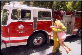 Evan arrives in a firetruck to fulfil her female fantasy
